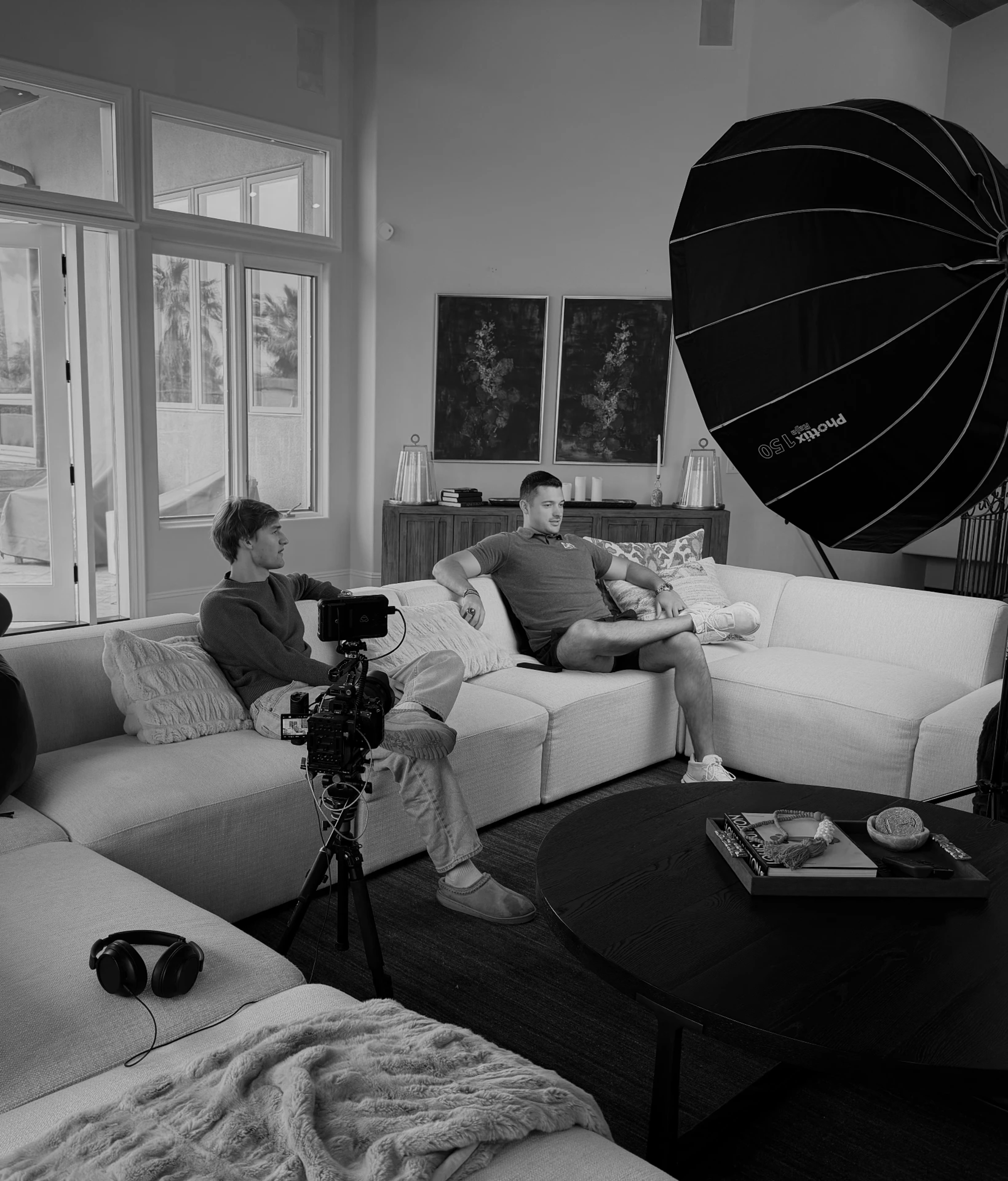 Prism Media team filming an interview on set with studio lighting